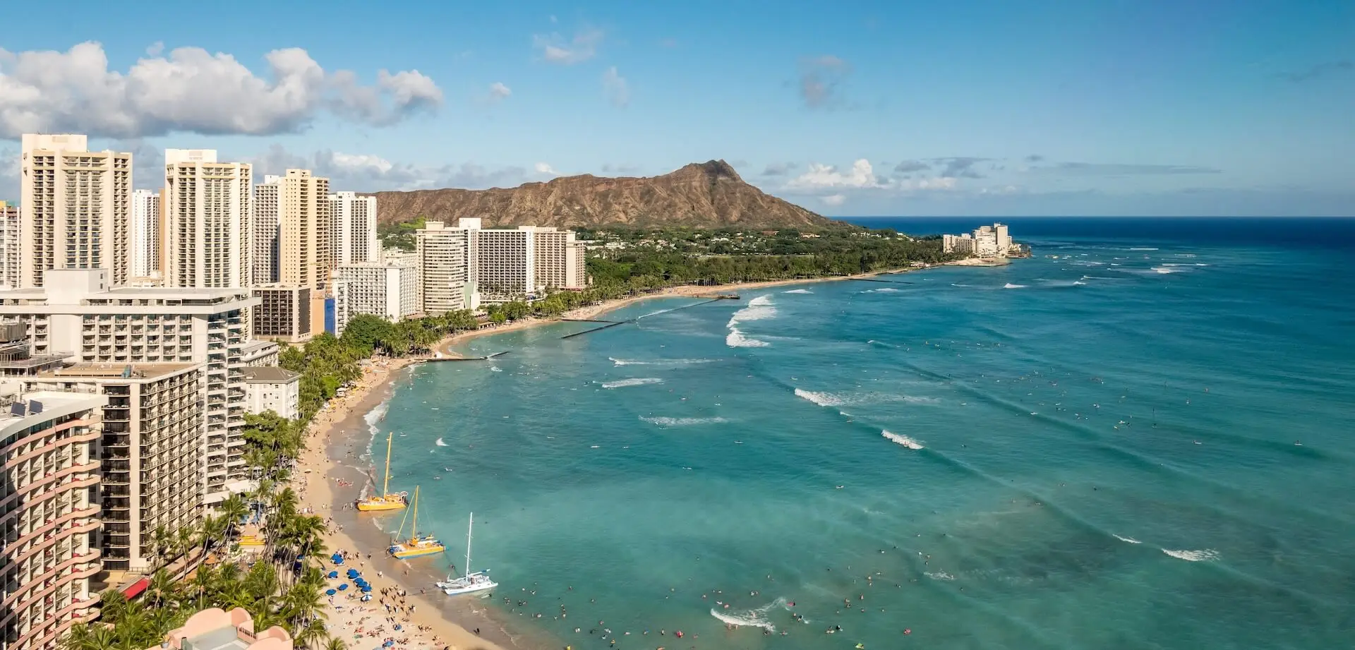 Clear blue water meets cityscape in Hawaii. ATTYX Roofing