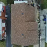 looking down on a roof with asphalt shingles. Attyx