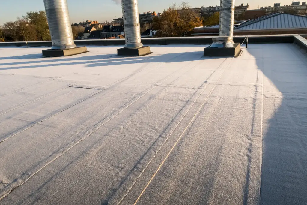 on a large building this frozen flat roof is in the middle of a big city